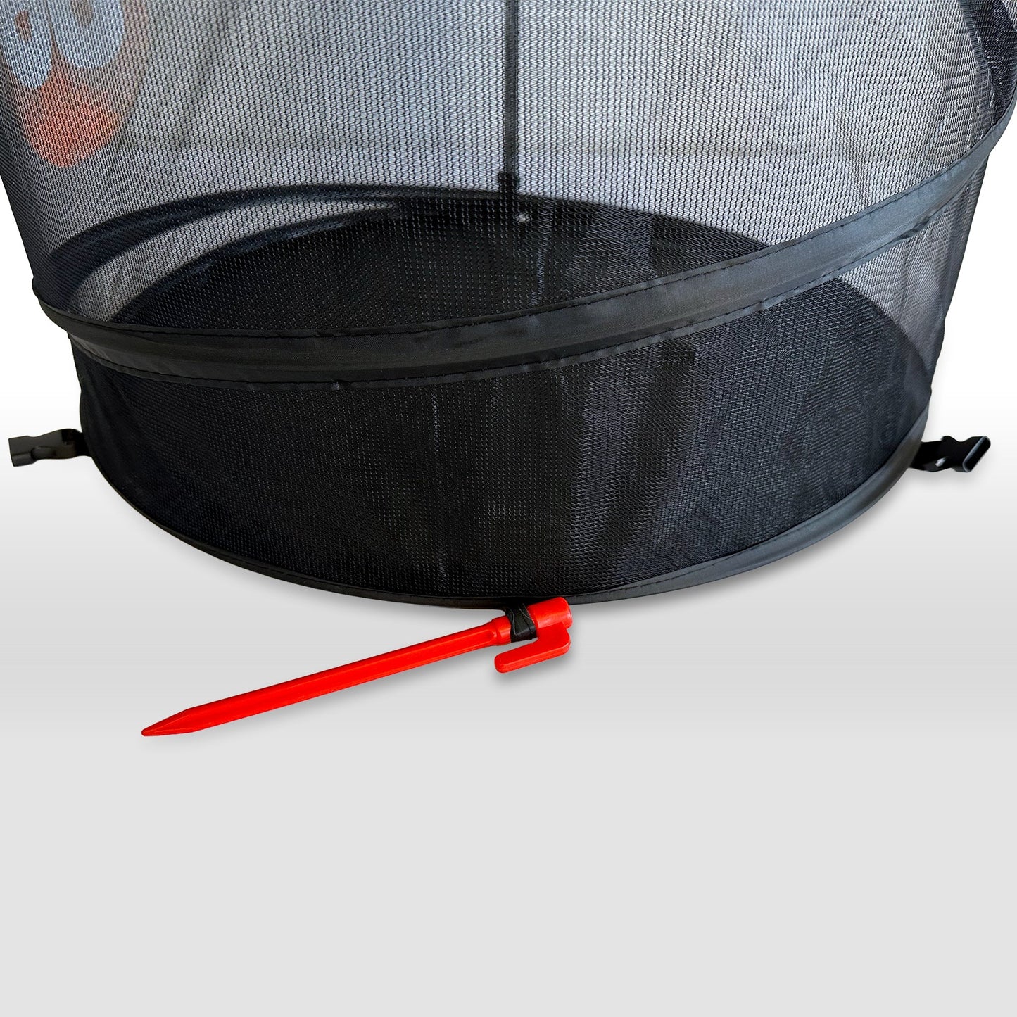 Close-up of RoundBol goal base with red stake anchor